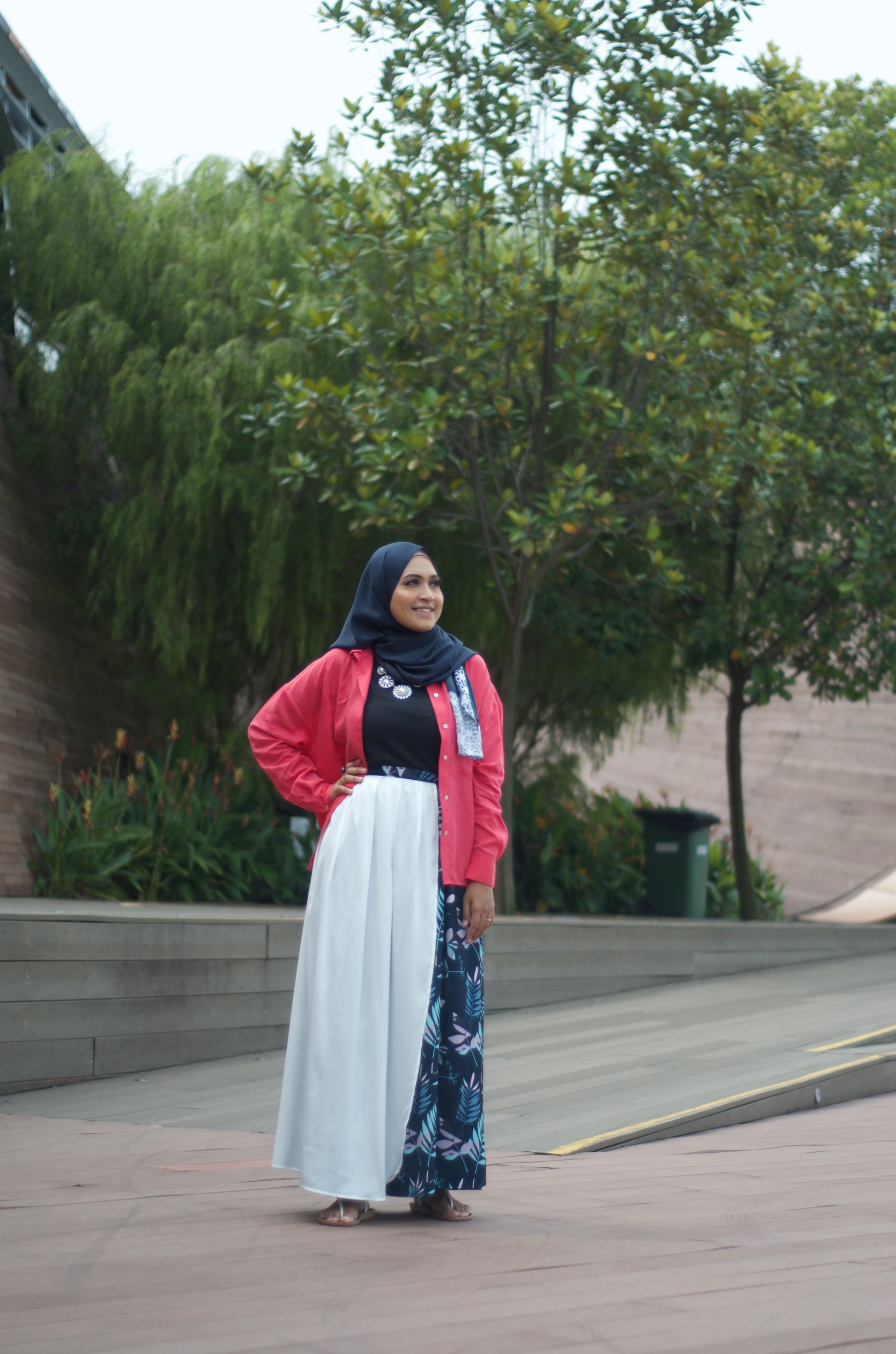 Person wearing a hijab in a navy blue maxi skirt